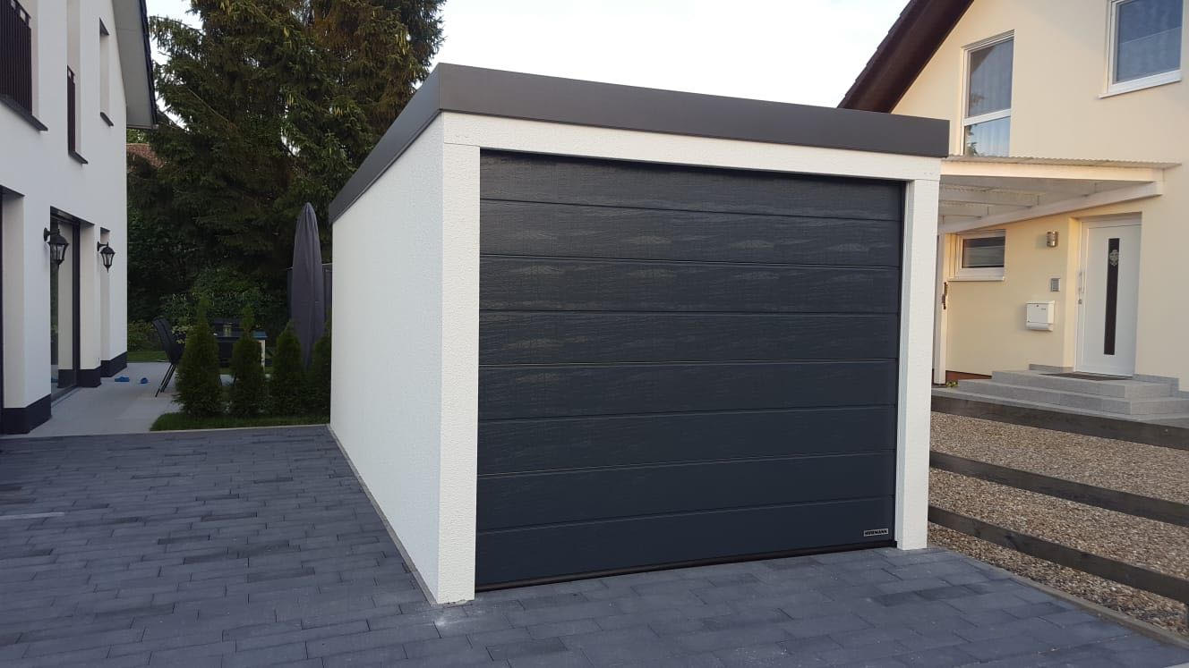 Massiv-Look Fertiggarage mit verputzter Fassade